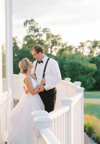 bride and groom posing on terrace