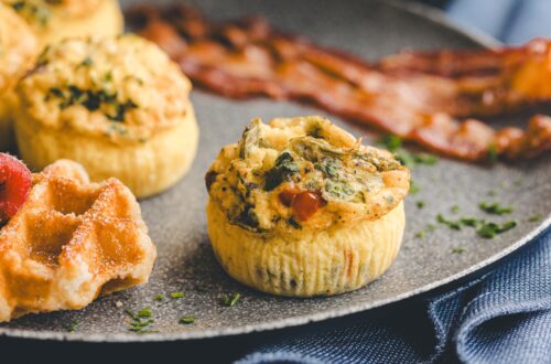 Hot breakfast plate: frittatas, bacon and waffles