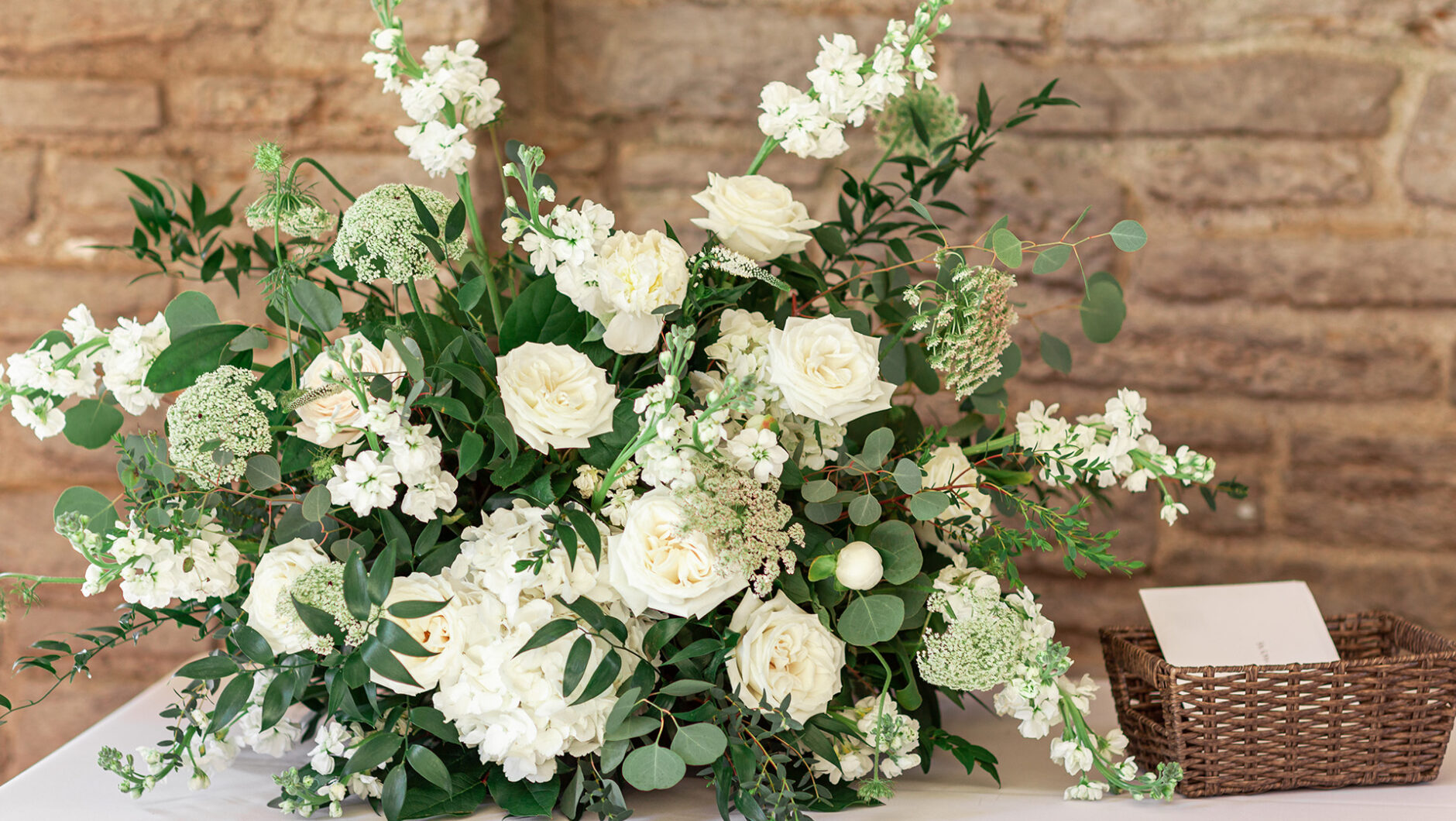 a full arrangement of green and white flowers