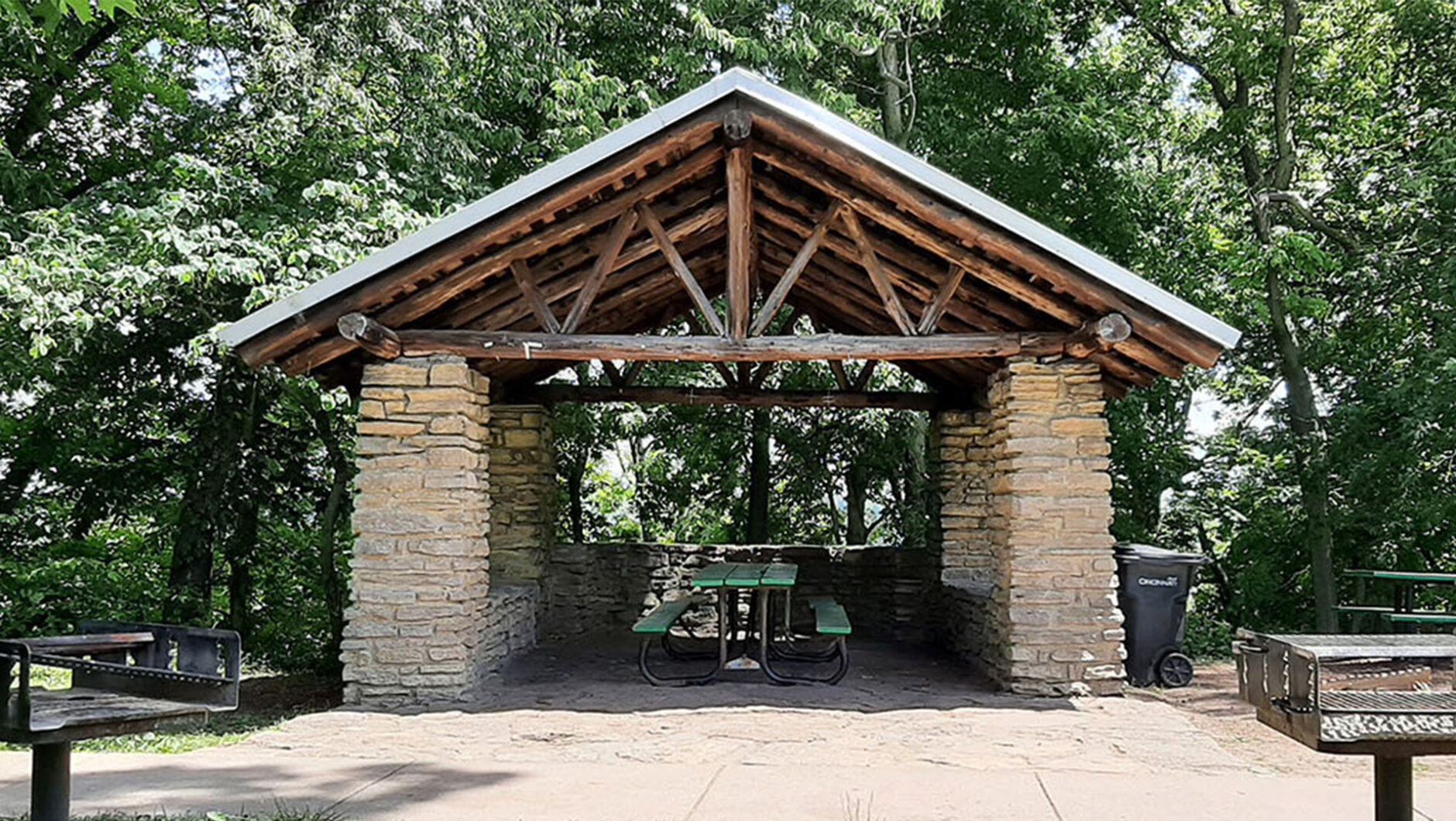 A picnic shelter at Alms park with picnic tables and grills